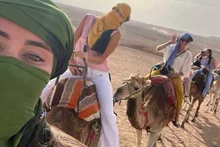 girls in agafay desert marrakech riding camel