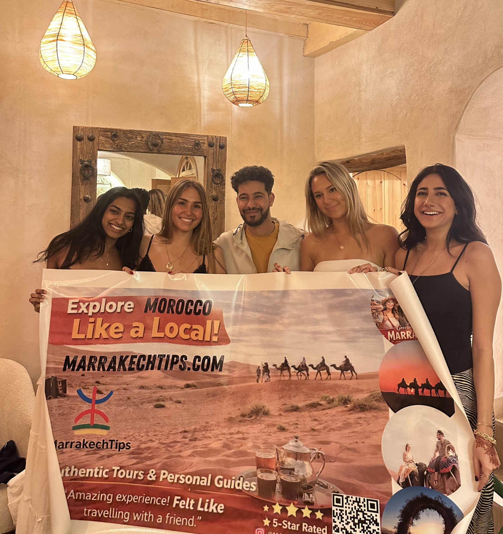 people holding a poster of a travel company